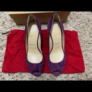 Christian Louboutin purple peeptoe pumps.